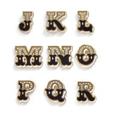 Letters J-R enamel pins with butterfly backer delicately handlettered in black, white, and gold.