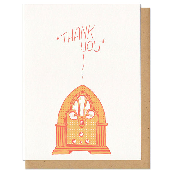 white greeting card with an illustrated old fashioned radio, printed in orange, beath hand-lettering that reads 