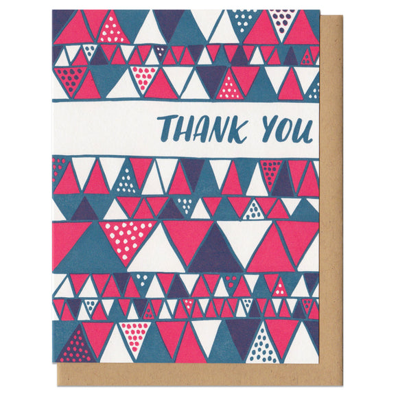 white greeting card with a red and blue illustrated triangles pattern and hand lettering that reads 