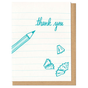 white greeting card with teal illustrated paper lines, pencil shavings, and a pencil next to hand lettering that reads "thank you"