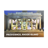 postcard featuring a photograph of the iconic Arcade mall lit up in the evening. white text reads "Providence, RI"