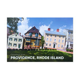 postcard photograph of very colorful historic buildings in daylight above white text that reads "greetings from providence, rhode island"