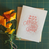 white greeting card with red hand lettering that reads "you are like some sort of mythical godess creature" pictured with orange poppies