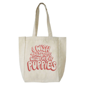 A cotton tote with handle screen printed in pink bubble letters that read "I wish this tote was full of puppies."