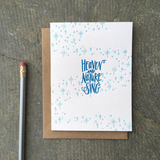 A greeting card and envelope featuring stars and dots in a swirling pattern with hand lettered script in the center that reads "heaven and nature sing"