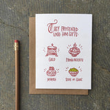 white greeting card with maroon writing that reads "they presented unto him gifts: gold, frank-incense, myrth, side of guac" featuring a small illustration above each gift, photographed with a pencil