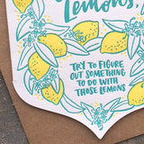deatil close up of illustrated lemons and handlettering that reads "try to figure out something to do with those lemons"