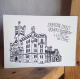 A 5" x 7" art print of the Cranston Street Armory in Providence RI. Text reads, "310 Cranston Street 165,000 square feet built in 1907. A castle for the people." The building is hand drawn in black and white.
