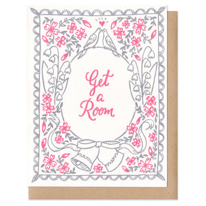 A greeting card with an envelope featuring grey and pink flowers, wedding bells, and kissing birds on top of a circle with script inside that says, "get a room." wedding, engagement, anniversary, romance, love