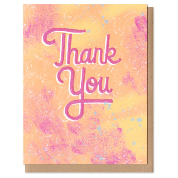 A greeting card and envelope featuring hand lettered text in pink that says, 