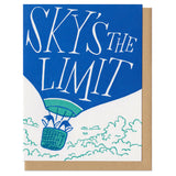 white greeting card featuring an illustration of two penguins riding in a hot air balloon. hand-lettering on the balloon reads "sky's the limit"