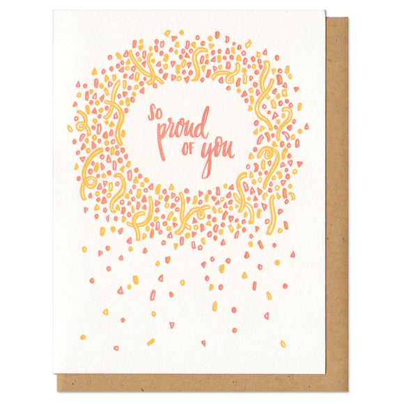 white greeting card with an illustrated circle of yellow and orange confetti surrounded hand-lettering that reads 