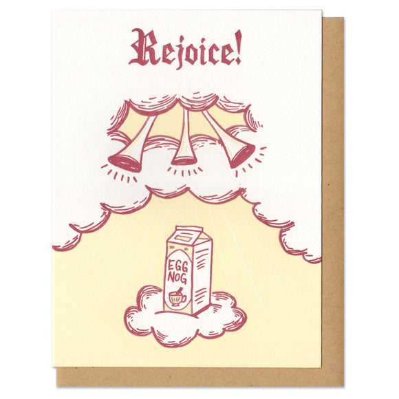 white greeting card featuring a maroon and yellow illustration of a carton of eggnog ascending twards trumpets in the clouds. hand lettering at the top reads 