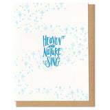 A greeting card and envelope featuring stars and dots in a swirling pattern with hand lettered script in the center that reads "heaven and nature sing"