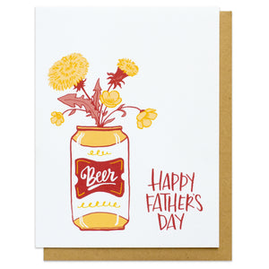 A greeting card and evelope featuring a can of beer with a gold and red label and a bouquet coming out the top with text next to it that reads "Happy Father's Day"