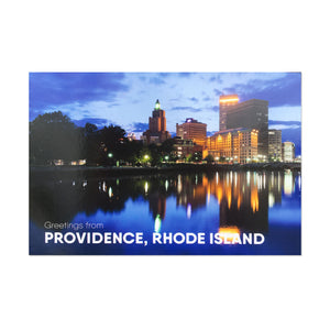 A sturdy postcard with a photo of downtown Providence at night lit up form the other side of the river. postcard, mail, snail mail, travel, stationery