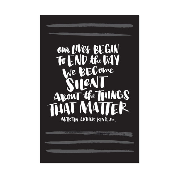 black postcard featuring a hand-lettered quote 
