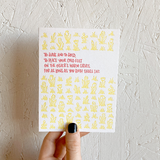 Kraft paper envelope and greeting card that reads "To have and to hold, to place your cold feet on the other's warm calves, for as long as you both shall live." In red, hand written type, surrounded by a yellow flower pattern.