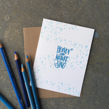 A greeting card and envelope featuring stars and dots in a swirling pattern with hand lettered script in the center that reads "heaven and nature sing"