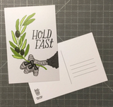 A postcard that have an eagle holding an olive branch with text that says "Hold fast"