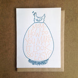 white greeting card featuring a blue illustration of a hen sitting atop an extremely large egg. orange hand-lettering on the egg reads "mom - how do you make it look so easy?"
