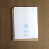 backside of the greeting card with light blue text that reads "Frog & Toad Press, frogandtoadpress.com, made in Providence, RI"