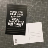 black postcard featuring a hand-lettered quote "Our lives begin to end the day we become silent about things that matter. Martin Luther King JR.", also showing the backside with room for an address, note, and stamp