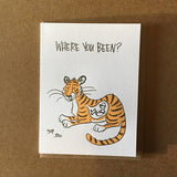 white greeting card thaht read "where you been?" above an illustration of a tiger with a man in his belly