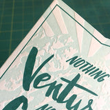 close up detail of a corner of the card showing the embossed letterpress texture
