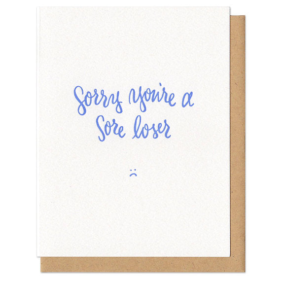 white greeting card with blue text that reads 