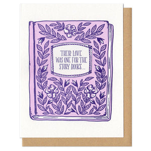 white greeting card with a pink and purple illustrated floral book-cover, it's titled "their love was one for the storybooks..."