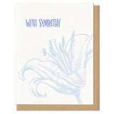white greeting card which reads "with sympathy" with an illustrated lily