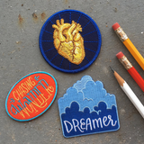 A collection of iron on embroidered patches