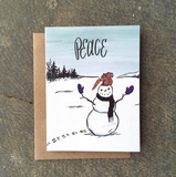  A greeting card featuring a squirrel on top of a snowman who has stolen the carrot nose with Peace written above it.