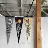 A collection of Star Wars pennants hanging on a wall.